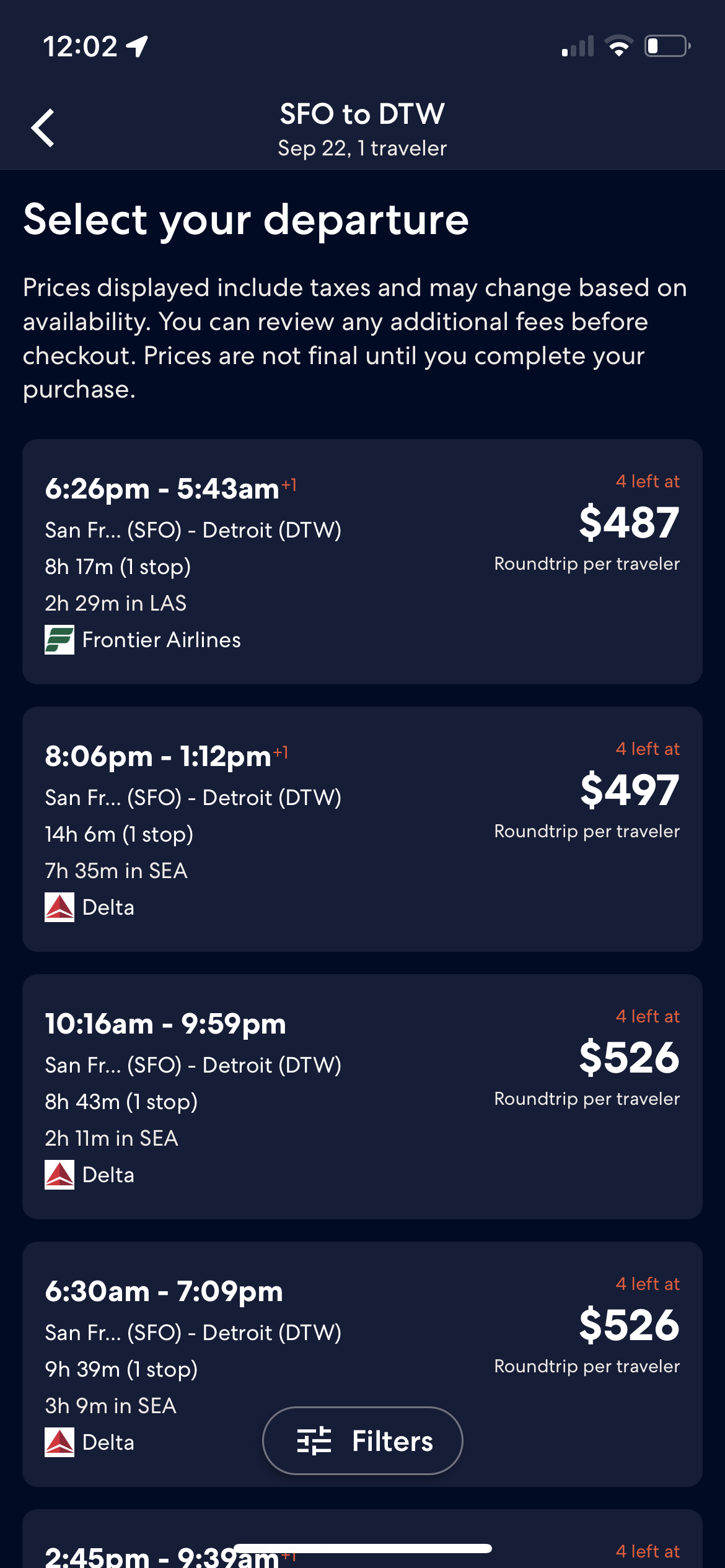 Expedia flight search results in dark mode